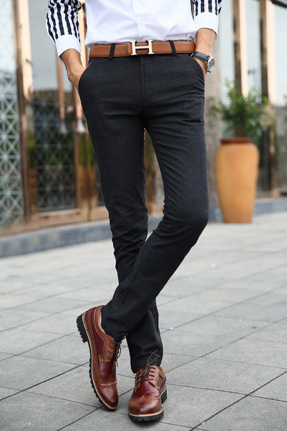 A winter men's casual pants cashmere trousers with thickened young Korean all-match slim feet long pants men wholesale